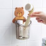 Teddy hook brush holder